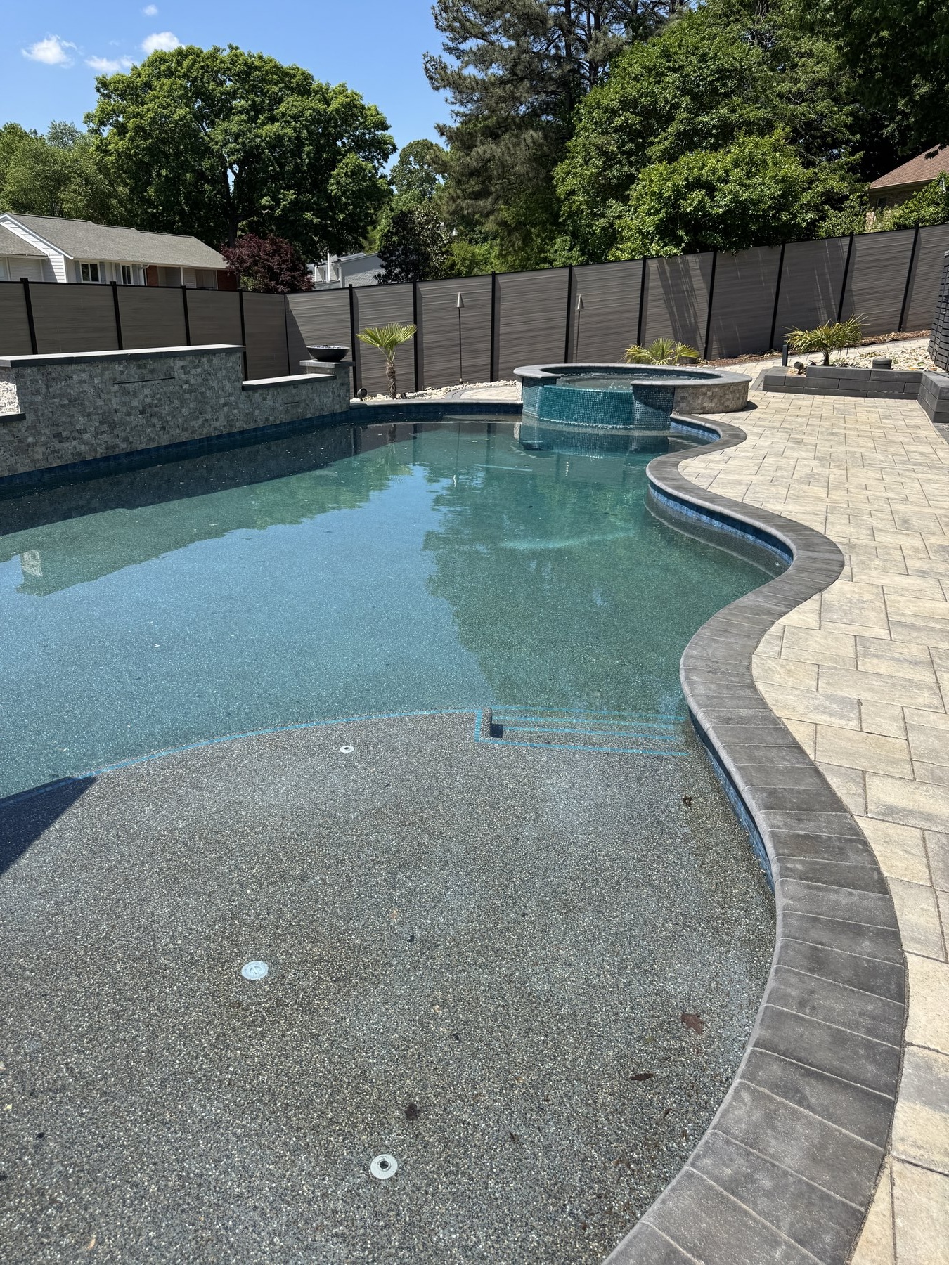 Completed custom inground pool with paver surround, Lake Norman NC